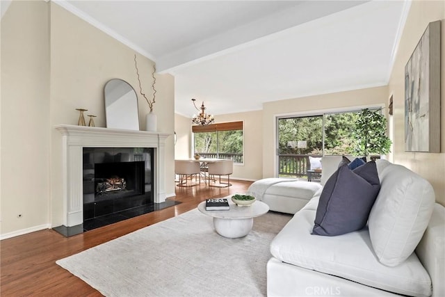31 Aspen Way, Rolling Hills Estates, CA 90274 - living area featuring wood finished floors, a chandelier, ornamental molding, and a fireplace