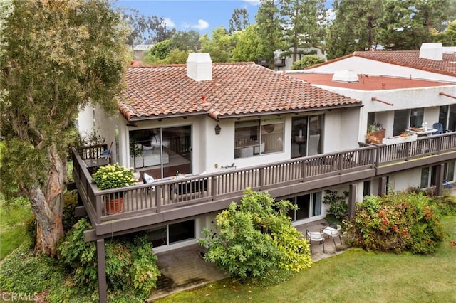 31 Aspen Way, Rolling Hills Estates, CA 90274 - back of property with a chimney, a tile roof, stucco siding, and a patio area