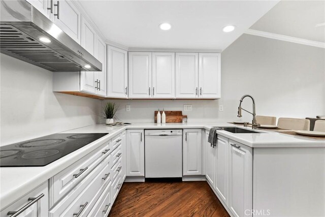 31 Aspen Way, Rolling Hills Estates, CA 90274 - kitchen featuring white dishwasher, under cabinet range hood, black electric cooktop, white cabinets, and a peninsula