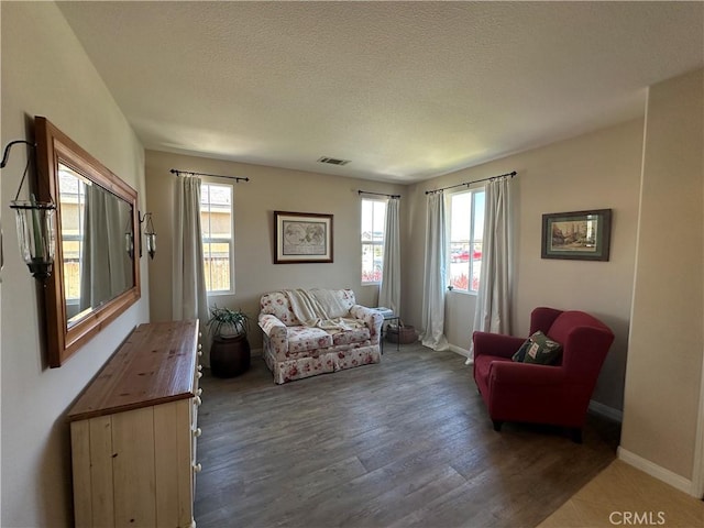 2408 Driftwood Dr, Rosamond, CA 93560 - living room featuring wood finished floors, baseboards, and a textured ceiling