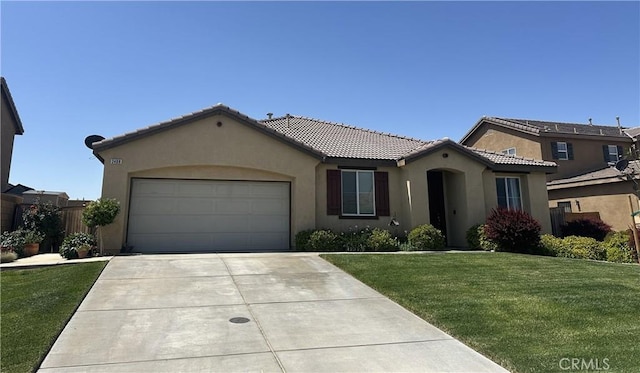 2408 Driftwood Dr, Rosamond, CA 93560 - mediterranean / spanish-style home with stucco siding, a tile roof, a garage, concrete driveway, and a front yard