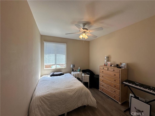 2408 Driftwood Dr, Rosamond, CA 93560 - bedroom with dark wood-style floors and ceiling fan