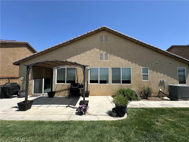 2408 Driftwood Dr, Rosamond, CA 93560 - rear view of house with central AC, a pergola, stucco siding, and a patio area