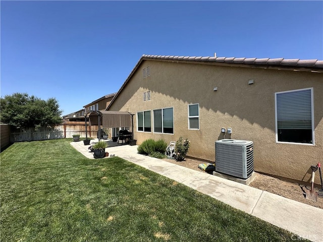 2408 Driftwood Dr, Rosamond, CA 93560 - rear view of house featuring central air condition unit, a patio, and stucco siding