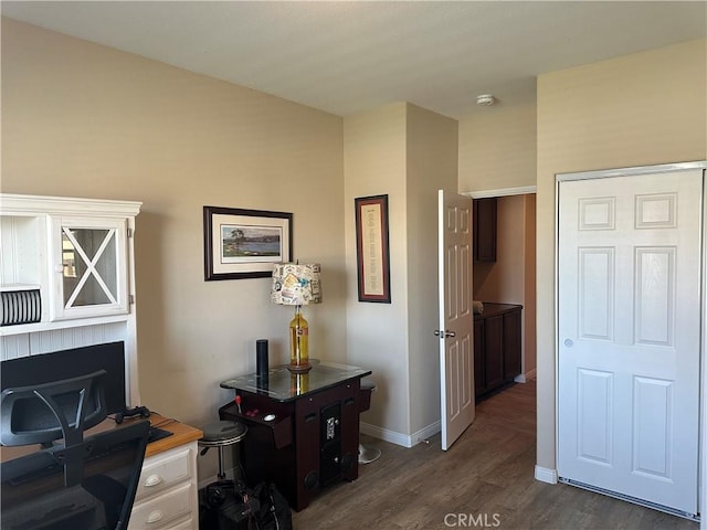 2408 Driftwood Dr, Rosamond, CA 93560 - office with dark wood finished floors and baseboards