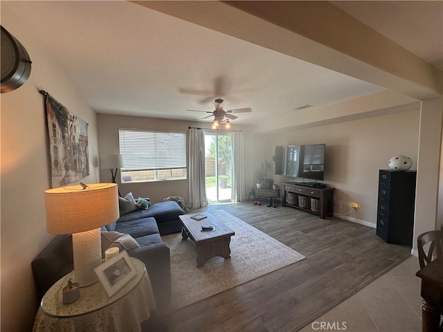 2408 Driftwood Dr, Rosamond, CA 93560 - living room featuring ceiling fan, baseboards, and wood finished floors