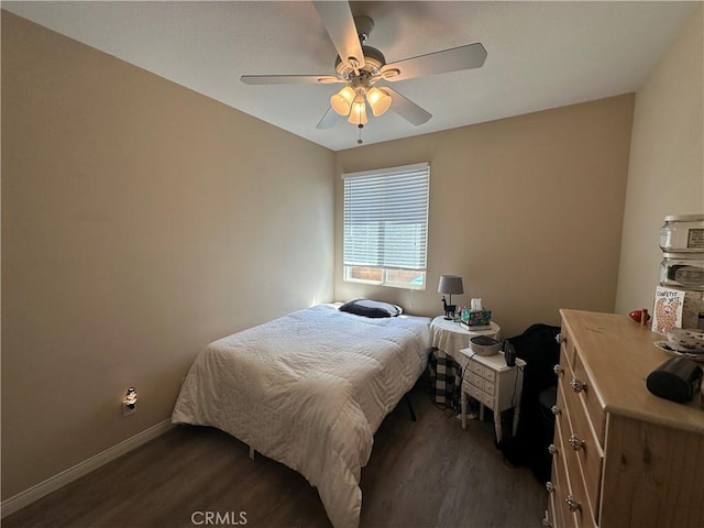 2408 Driftwood Dr, Rosamond, CA 93560 - bedroom with dark wood-type flooring, baseboards, and a ceiling fan