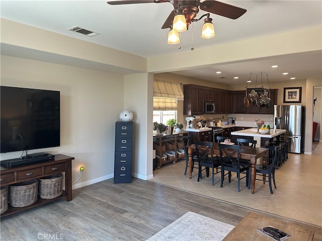 2408 Driftwood Dr, Rosamond, CA 93560 - dining area with ceiling fan, light wood finished floors, recessed lighting, and baseboards