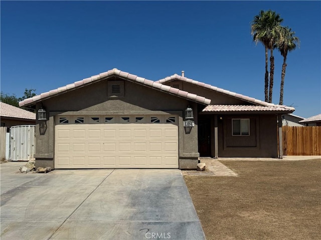 774 Josie St, Blythe, CA 92225 - ranch-style home with a garage, driveway, a tiled roof, and stucco siding