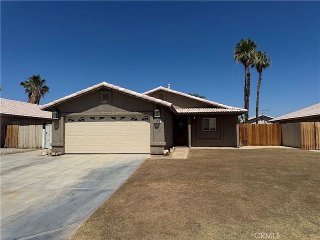 774 Josie St, Blythe, CA 92225 - ranch-style house with a garage, driveway, stucco siding, and a tile roof