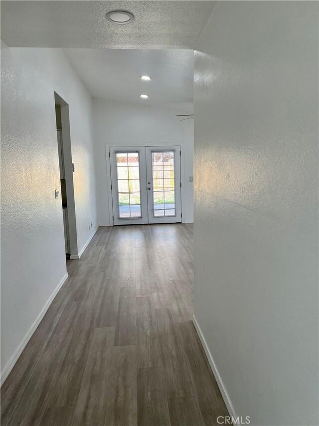 774 Josie St, Blythe, CA 92225 - hallway featuring baseboards, french doors, and dark wood-style floors