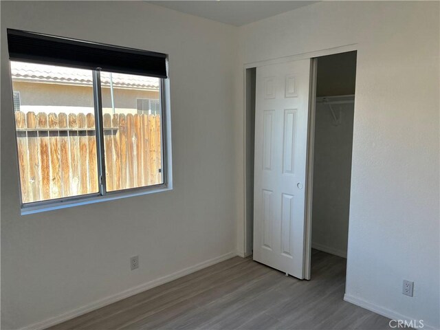 774 Josie St, Blythe, CA 92225 - unfurnished bedroom featuring wood finished floors, a closet, and baseboards