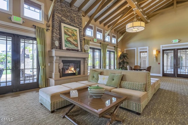 1542 Windshore Way, Oxnard, CA 93035 - living room featuring french doors, high vaulted ceiling, beamed ceiling, and a large fireplace