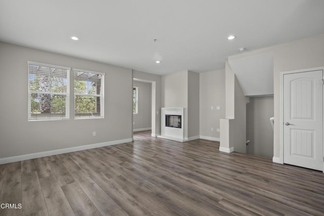 1542 Windshore Way, Oxnard, CA 93035 - unfurnished living room featuring wood finished floors, recessed lighting, and a multi sided fireplace