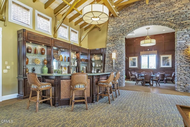 1542 Windshore Way, Oxnard, CA 93035 - community bar area with high vaulted ceiling, wood finished floors, beam ceiling, arched walkways, and pendant lighting