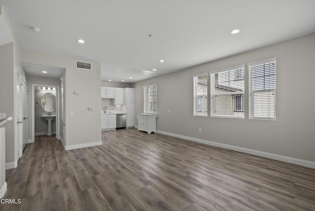 1542 Windshore Way, Oxnard, CA 93035 - unfurnished living room with wood finished floors and recessed lighting