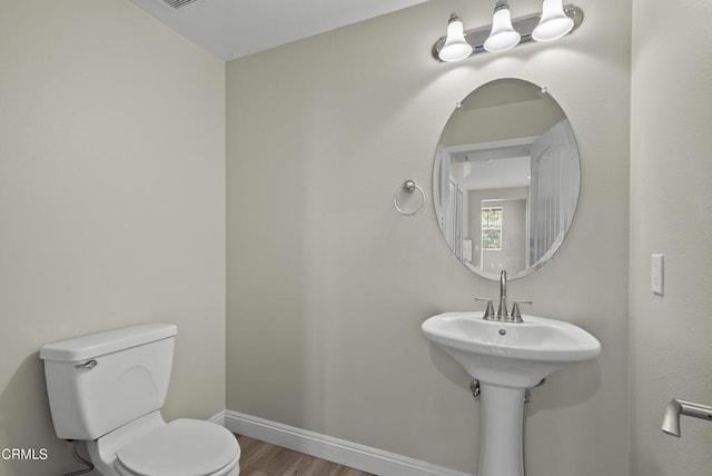 1542 Windshore Way, Oxnard, CA 93035 - half bath featuring toilet and wood finished floors