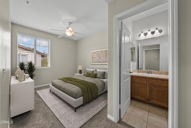 1542 Windshore Way, Oxnard, CA 93035 - bedroom with light colored carpet, connected bathroom, light tile patterned floors, and ceiling fan