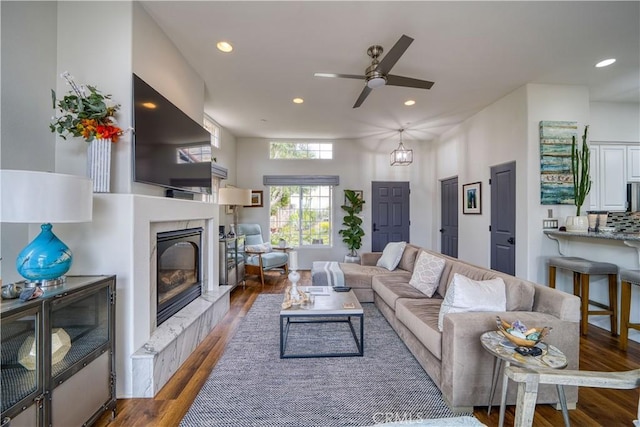 516 Stoneridge Dr, San Luis Obispo, CA 93401 - living room with a glass covered fireplace, wood finished floors, a ceiling fan, and recessed lighting