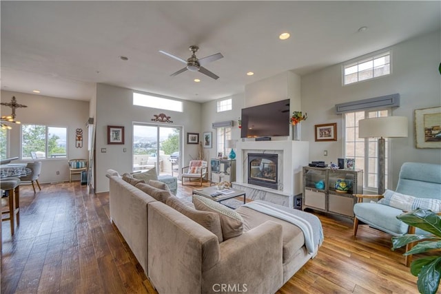 516 Stoneridge Dr, San Luis Obispo, CA 93401 - living room featuring plenty of natural light, a fireplace, hardwood / wood-style flooring, recessed lighting, and a high ceiling