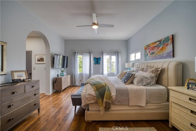 516 Stoneridge Dr, San Luis Obispo, CA 93401 - bedroom with dark wood-style floors, arched walkways, and ceiling fan