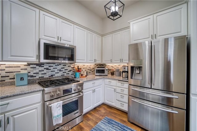 516 Stoneridge Dr, San Luis Obispo, CA 93401 - kitchen with appliances with stainless steel finishes, tasteful backsplash, white cabinetry, dark wood-type flooring, and light stone counters