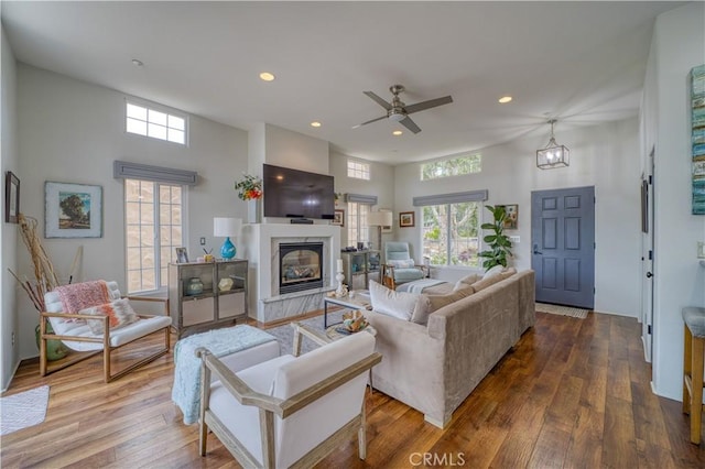 516 Stoneridge Dr, San Luis Obispo, CA 93401 - living area with a glass covered fireplace, plenty of natural light, dark wood-style floors, and recessed lighting