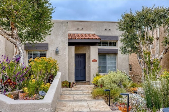 516 Stoneridge Dr, San Luis Obispo, CA 93401 - entrance to property featuring stucco siding and a tile roof