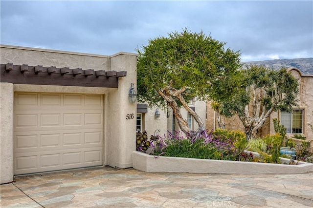 516 Stoneridge Dr, San Luis Obispo, CA 93401 - view of front of home with stucco siding and an attached garage