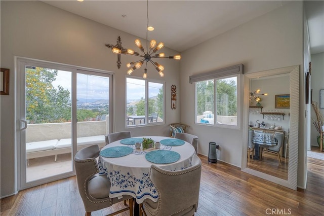 516 Stoneridge Dr, San Luis Obispo, CA 93401 - dining space with a chandelier, wood finished floors, and high vaulted ceiling