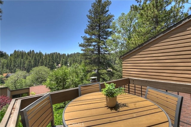 27657 Peninsula Dr Unit 131, Lake Arrowhead, CA 92352 - wooden terrace with a forest view and outdoor dining space