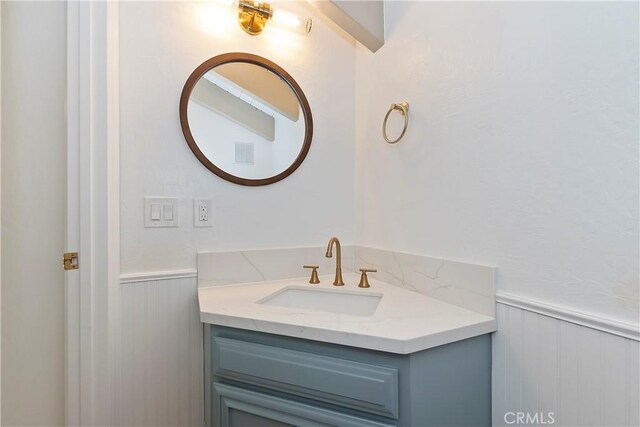 27657 Peninsula Dr Unit 131, Lake Arrowhead, CA 92352 - bathroom with vanity and wainscoting