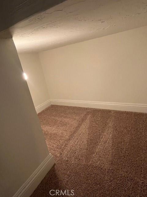 27657 Peninsula Dr Unit 131, Lake Arrowhead, CA 92352 - empty room with baseboards and carpet flooring