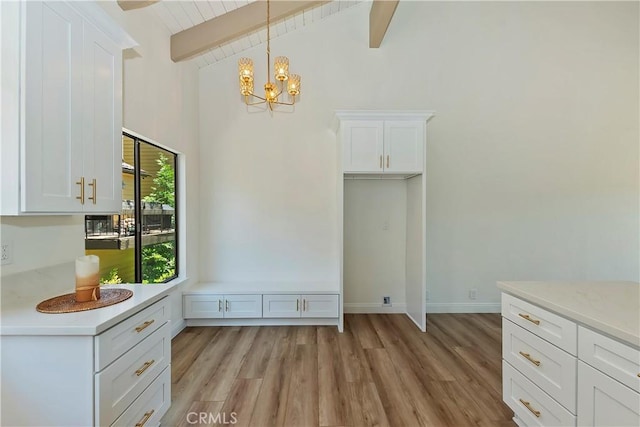 27657 Peninsula Dr Unit 131, Lake Arrowhead, CA 92352 - unfurnished dining area featuring light wood-type flooring and a chandelier