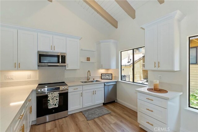 27657 Peninsula Dr Unit 131, Lake Arrowhead, CA 92352 - kitchen featuring appliances with stainless steel finishes, open shelves, white cabinets, and light countertops