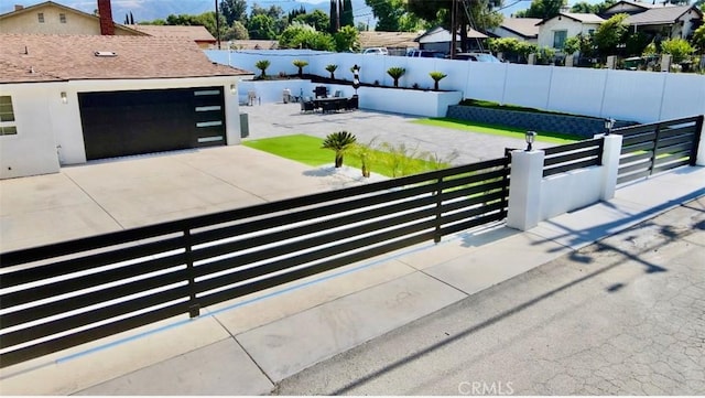 7401 Liberty Ave, Corona, CA 92881 - view of patio / terrace featuring concrete driveway and a garage