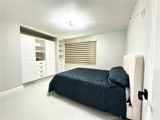 7401 Liberty Ave, Corona, CA 92881 - bedroom featuring finished concrete floors and baseboards
