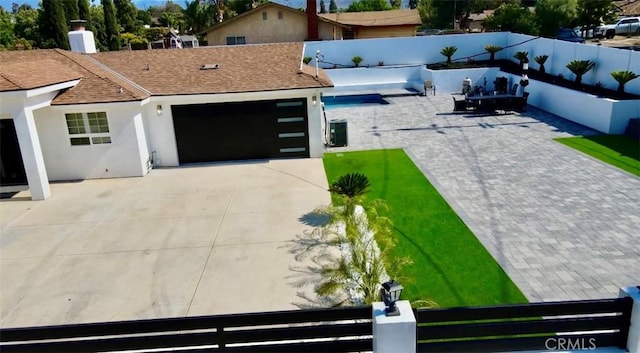7401 Liberty Ave, Corona, CA 92881 - view of front of house featuring concrete driveway, a garage, roof with shingles, and stucco siding