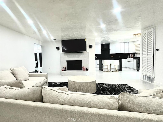 7401 Liberty Ave, Corona, CA 92881 - living area with a fireplace with raised hearth and baseboards