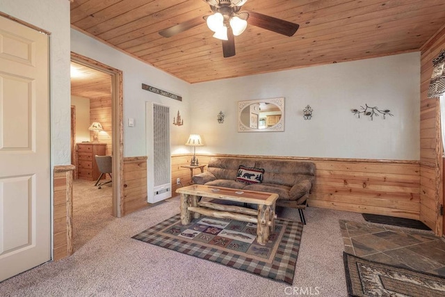 618 Sugarloaf Blvd, Big Bear City, CA 92314 - living room featuring a heating unit, wooden ceiling, carpet, a wainscoted wall, and wooden walls