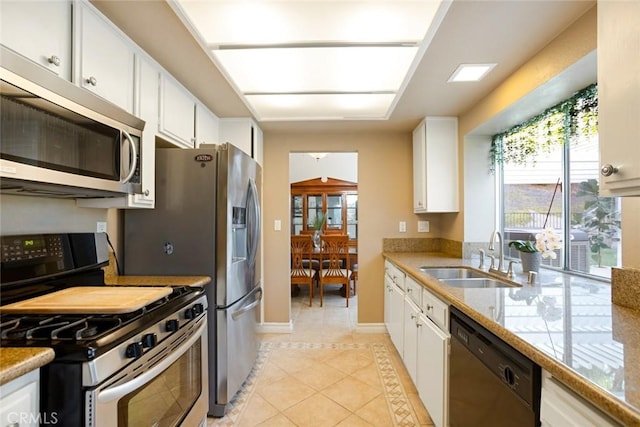 2424 Norte Vista Dr, Chino Hills, CA 91709 - kitchen featuring stainless steel appliances, a sink, light tile patterned flooring, white cabinetry, and light countertops