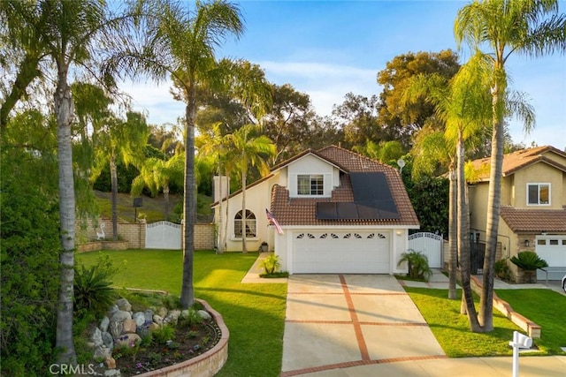 2424 Norte Vista Dr, Chino Hills, CA 91709 - view of front of property featuring a tiled roof, stucco siding, a gate, roof mounted solar panels, and concrete driveway