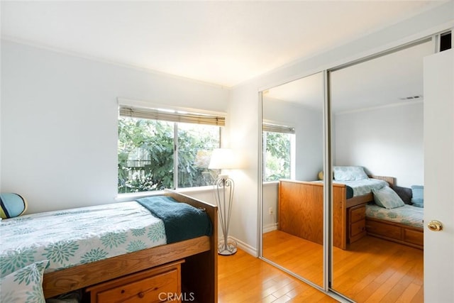 2424 Norte Vista Dr, Chino Hills, CA 91709 - bedroom featuring light wood finished floors, a closet, and baseboards