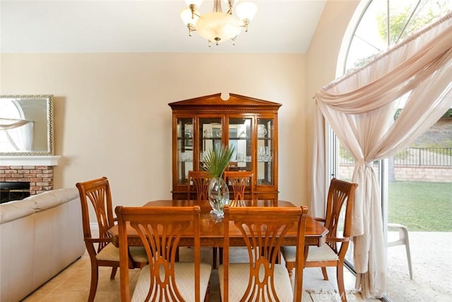 2424 Norte Vista Dr, Chino Hills, CA 91709 - dining room with a chandelier, a brick fireplace, and light tile patterned floors