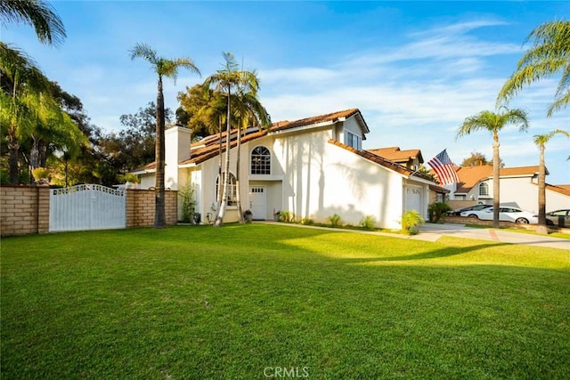 2424 Norte Vista Dr, Chino Hills, CA 91709 - view of side of property featuring a garage, a gate, stucco siding, a lawn, and concrete driveway
