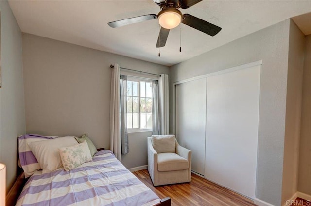 24920 Via Lopez Ct, Ramona, CA 92065 - bedroom with wood finished floors, a closet, and ceiling fan