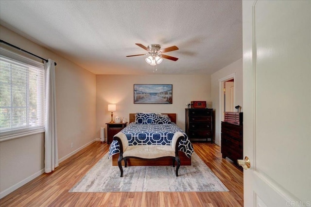 24920 Via Lopez Ct, Ramona, CA 92065 - bedroom featuring light wood-type flooring, baseboards, a textured ceiling, and ceiling fan