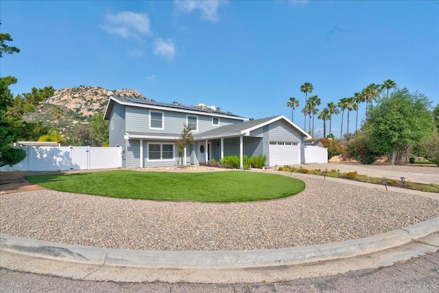 24920 Via Lopez Ct, Ramona, CA 92065 - traditional-style home with a gate, a garage, roof mounted solar panels, and driveway