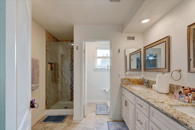 24920 Via Lopez Ct, Ramona, CA 92065 - bathroom with double vanity, a shower stall, tile patterned floors, and baseboards