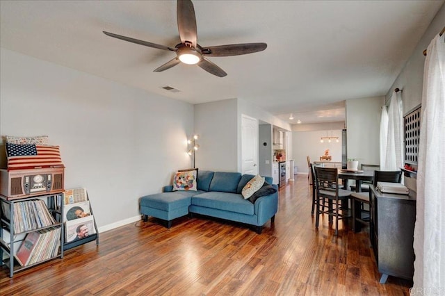 24920 Via Lopez Ct, Ramona, CA 92065 - living room with ceiling fan, wood finished floors, baseboards, and a chandelier